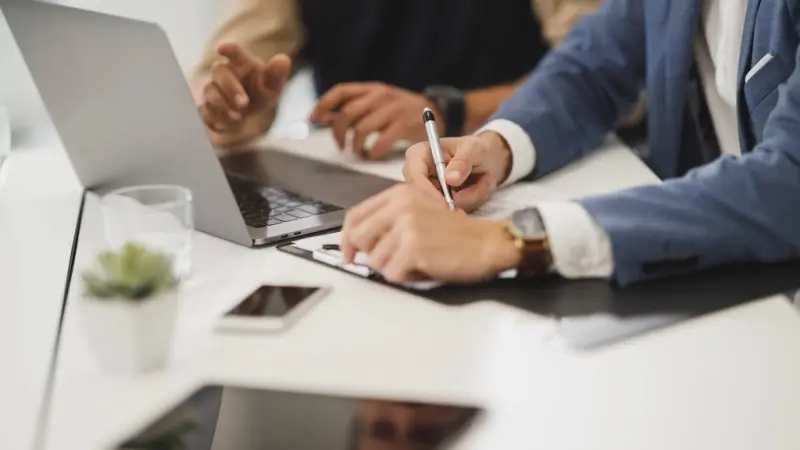 Signing an employment contract at a desk
