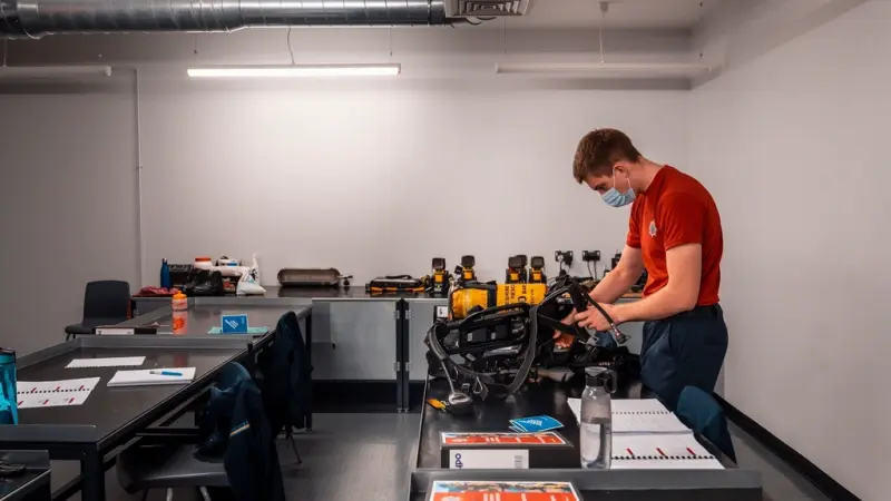 A trainee working in a technical training workshop